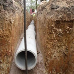 Laying main drain pipes