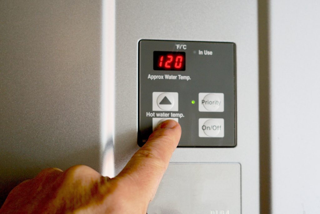 finger on hot water heater control unit 2021 08 29 04 32 24 utc