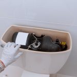 Toilet being repaired